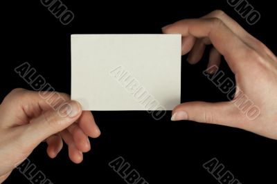 Hands holding a white card