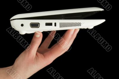 Netbook held by fingers