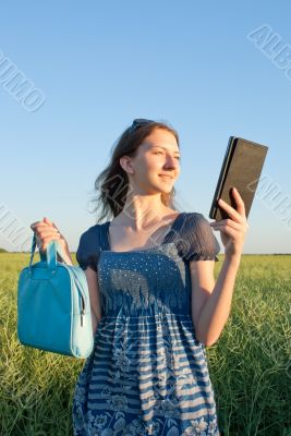 Teen girl with electronic book reader