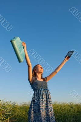 Teen girl with electronic book reader 