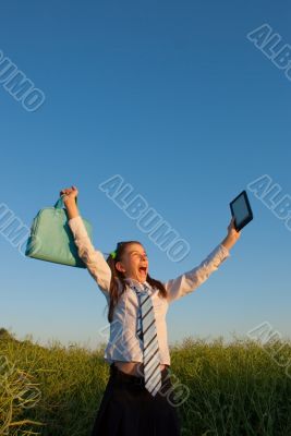 Teen girl with electronic book reader