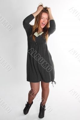 The girl the visagiste in a gray dress