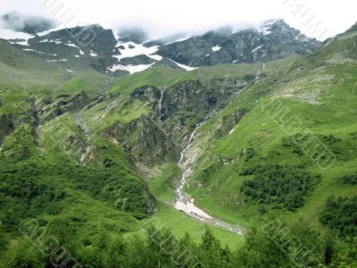 Mountain under the blue sky and the clouds