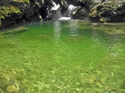 Green river and waterfall