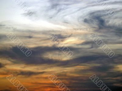 Curved clouds on the sunset