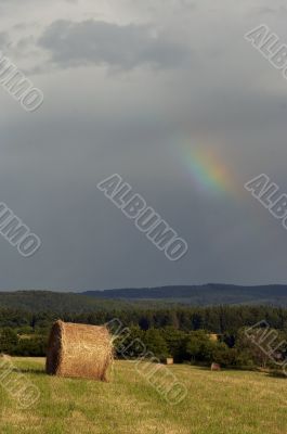 overcast sky with rainbow