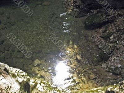 Sunbeam reflection in the clear water