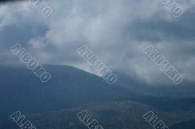 Clouds and mountains.