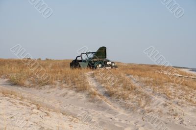 Car broken in sands.