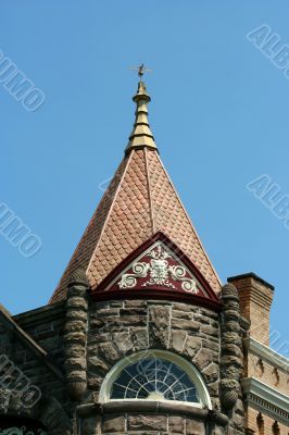 Weather vane on top of an old building