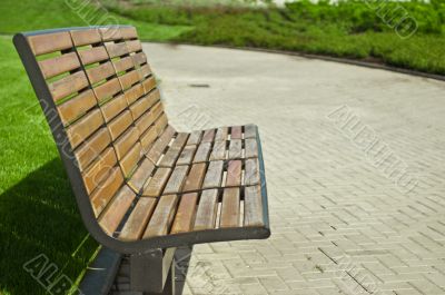 wooden bench in a city park