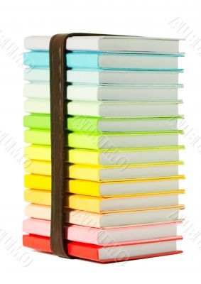 Stack of colorful books on the white background