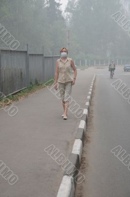 Woman walking in Heavy Smog