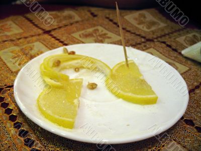 Sliced lemon on the plate