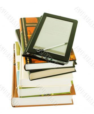 Stack of books and electronic book reader