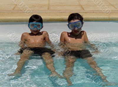 two boys in swimming pool