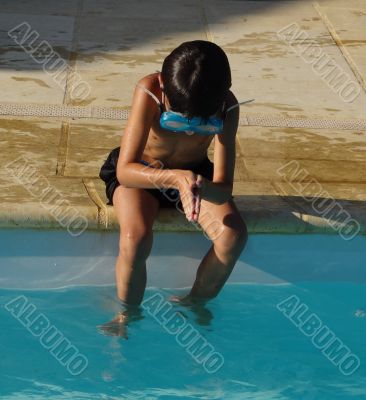 boy's diving in a swimming pool