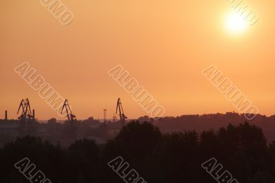 Sunrise over the cargo cranes