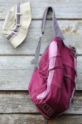 Khaki Hat and Purple Backpack