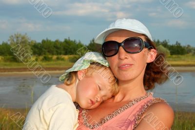 Mother and small slipping daughter