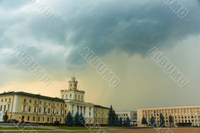 Storm clouds over buildings