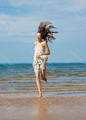 Happy Woman on the Beach.Happy woman