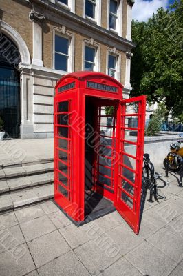 Old red telephone box in London