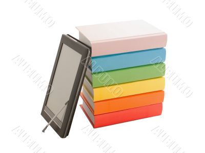 Stack of colorful books and e-book reader