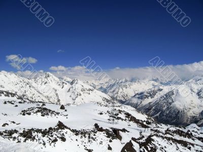 Mountain under the blue sky and the clouds