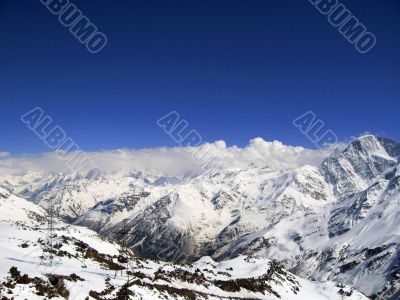 Mountain under the blue sky and the clouds