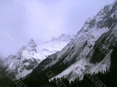 Mountain under the blue sky and the clouds