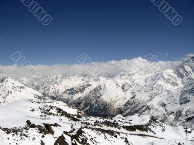 Mountain under the blue sky and the clouds
