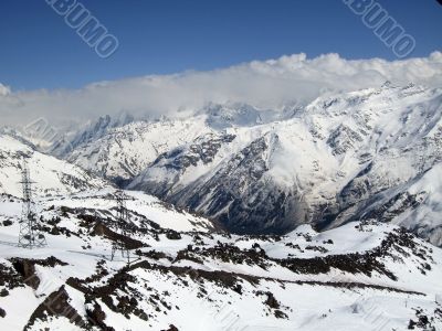 Mountain under the blue sky and the clouds