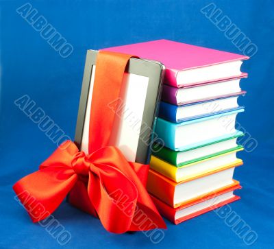 Electronic book reader tied up with red ribbon