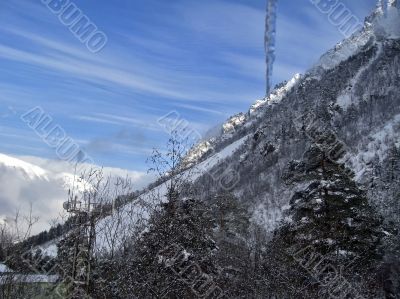 Mountain under the blue sky and the clouds