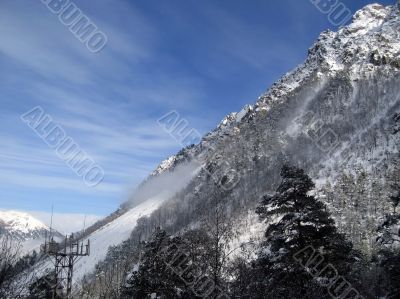 Mountain under the blue sky and the clouds