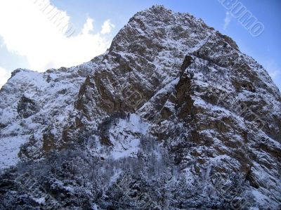 Mountain under the blue sky and the clouds