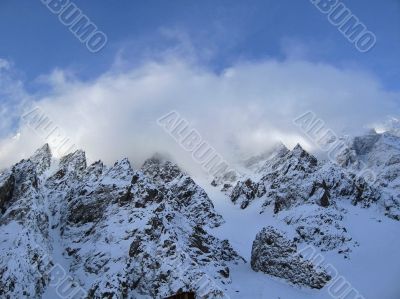 Mountain under the blue sky and the clouds