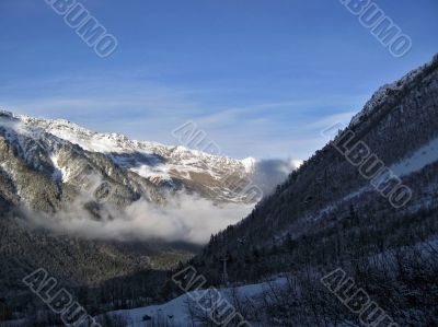 Mountain under the blue sky and the clouds