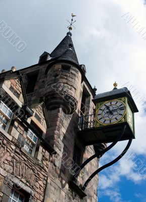 old city clock on stone tower