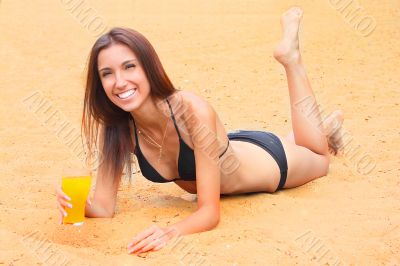 The young girl has a rest on a wood beach