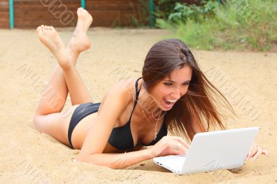 The young girl has a rest on a wood beach