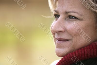 Mature woman looking away smiling