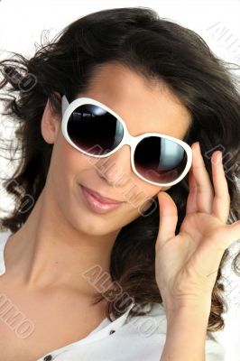 Young woman in oversized sunglasses
