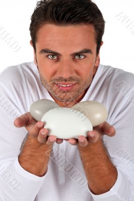 Portrait of a man with pebbles