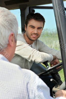 father and son working in the vineyard