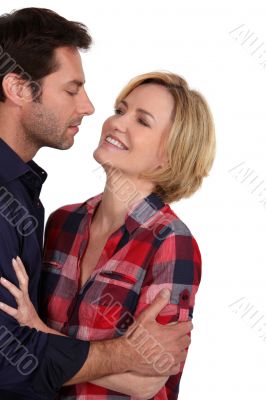 Couple stood closely looking each other
