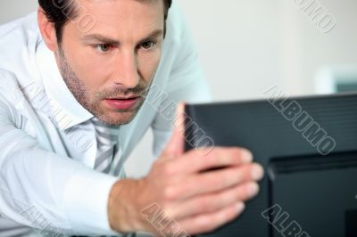close-up of a man with computer