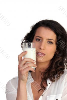 Woman drinking a glass of milk