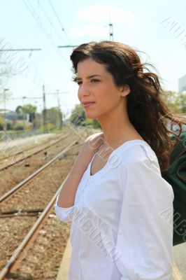 Woman waiting at train station